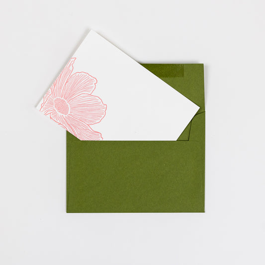 Set of 10 Letterpress Note Cards featuring a hand-drawn cosmos flower, letterpress printed in a soft peachy-pink ink onto 100% cotton paper. Includes 10 rich green envelopes. Size A6.