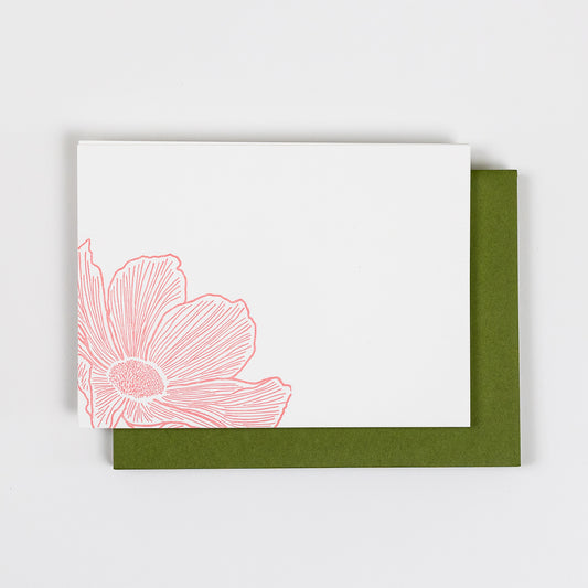 Set of 10 Letterpress Note Cards featuring a hand-drawn cosmos flower, letterpress printed in a soft peachy-pink ink onto 100% cotton paper. Includes 10 rich green envelopes. Size A6.
