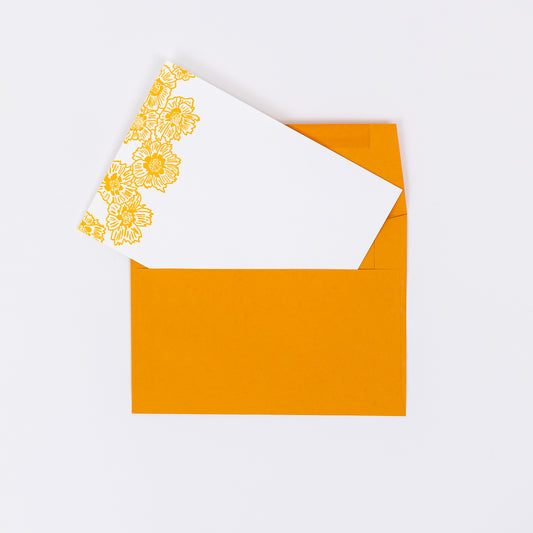 Set of 10 Letterpress Note Cards featuring hand-drawn Coreopsis Flowers letterpress printed in a vibrant golden orange ink onto 100% cotton paper. Includes 10 bright orange envelopes. Size A6.