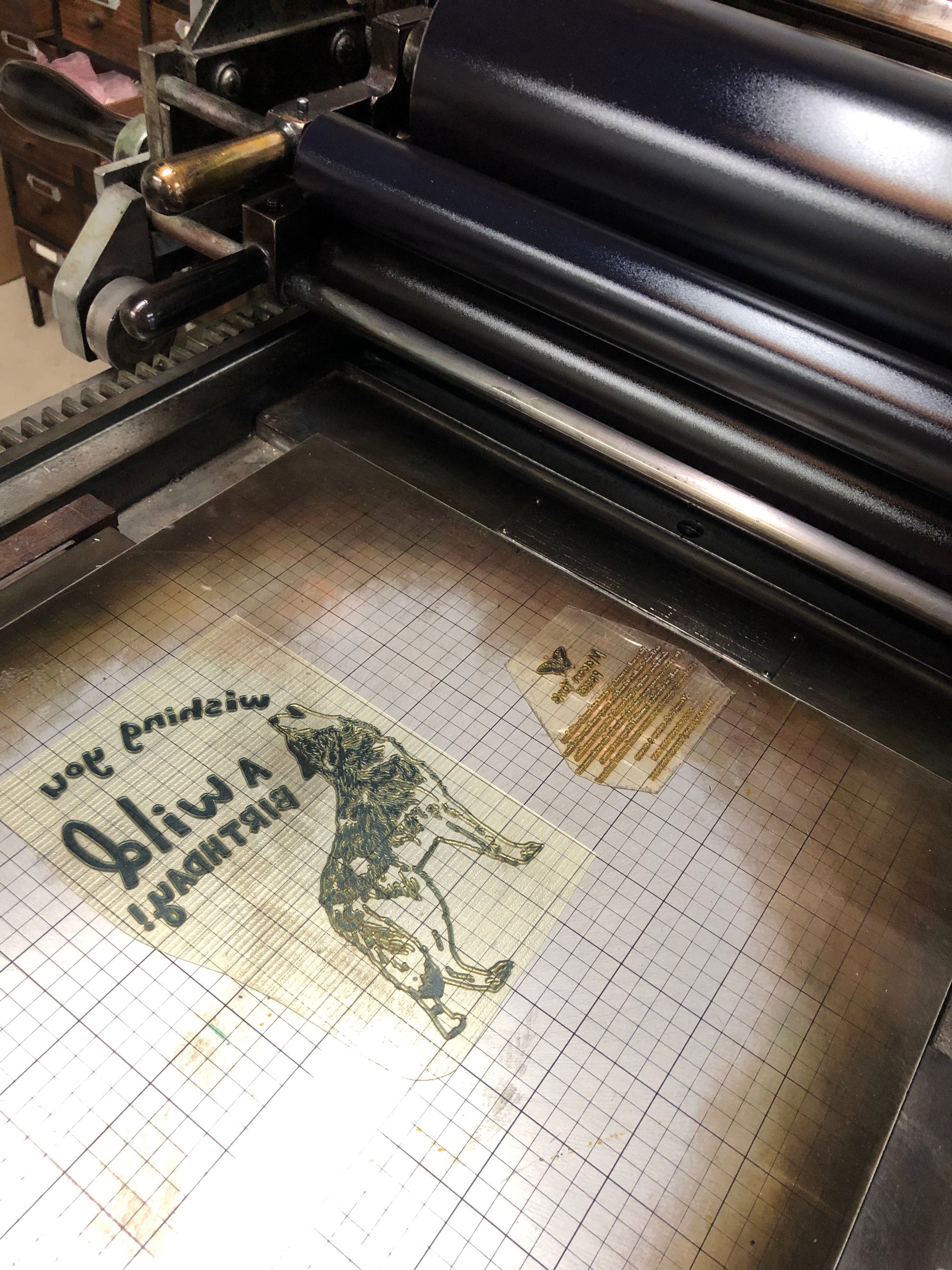 Image of the wolf plate on the base of a Vandercook Letterpress Machine.