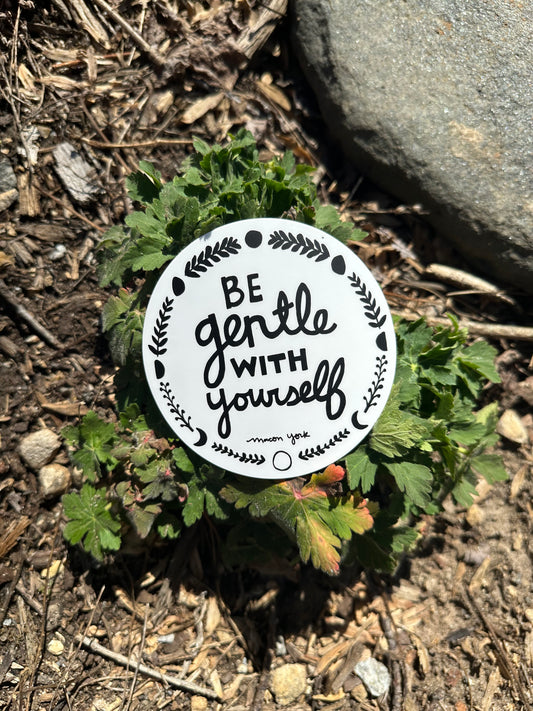 This vinyl sticker features an excerpt from my all-time favorite poem “Desiderata” by Max Ehrman, hand-drawn in a funky folk-art style of Macon York. Phases of the moon and hand-drawn ferns and plants provide a circular border around the text. 4"x4" Circle Vinyl Sticker. Sticker is shown on a budding bed of mugwort. 