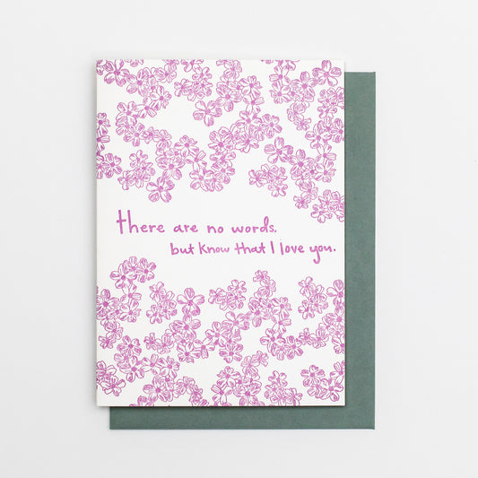 Letterpress greeting card featuring hand-drawn phlox flowers, printed in vibrant lavender ink. Whimsical hand-drawn text saying "There are no words, but know that I love you" is shown in the center of the card, in the same lavender ink. The card is white, blank inside, and is paired with a slate gray envelope.